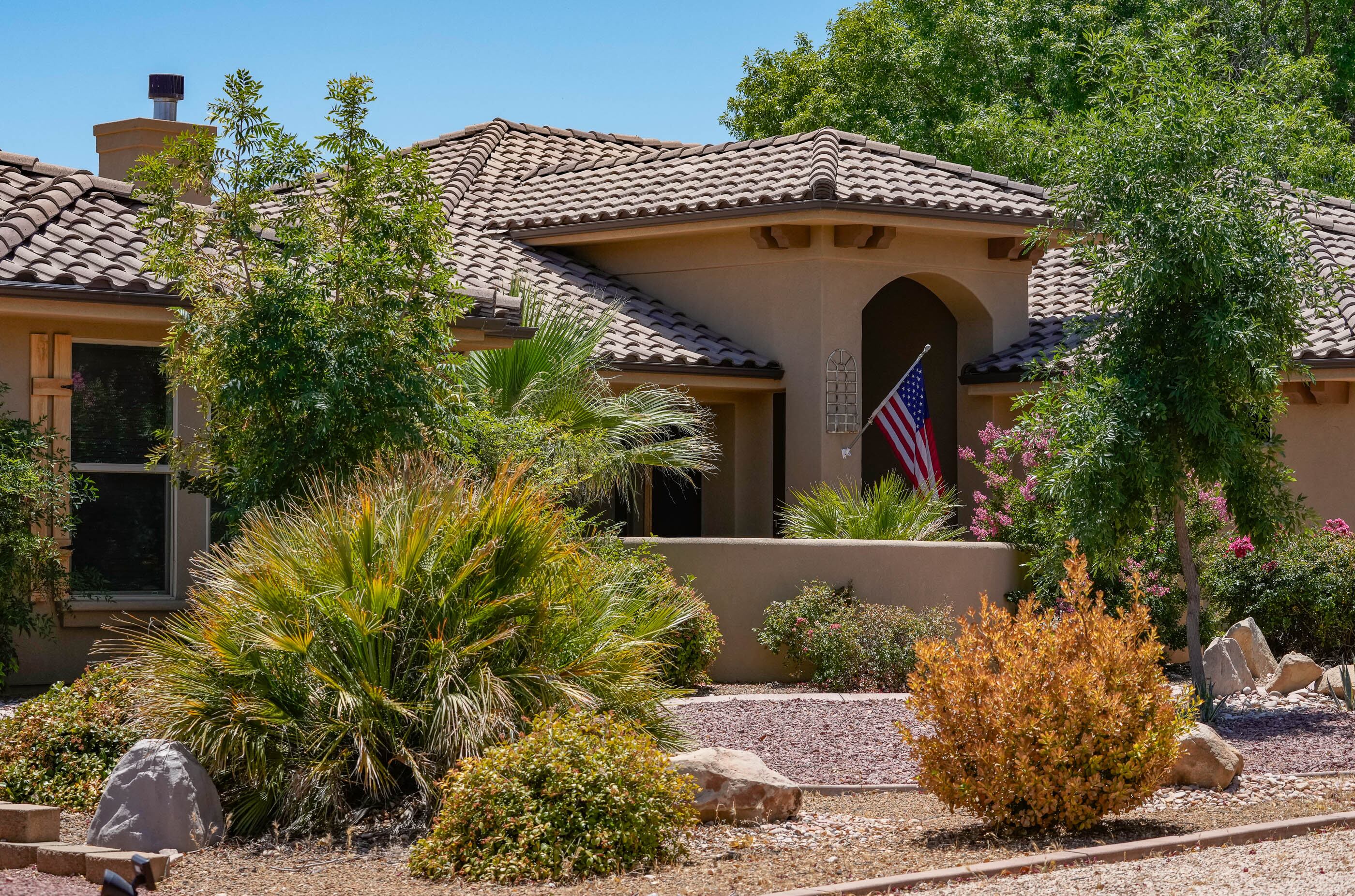 Stucco home with tile roof and desert landscaping in St. George, Utah